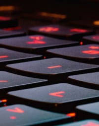 A close-up photograph of the keys on a laptop keyboard